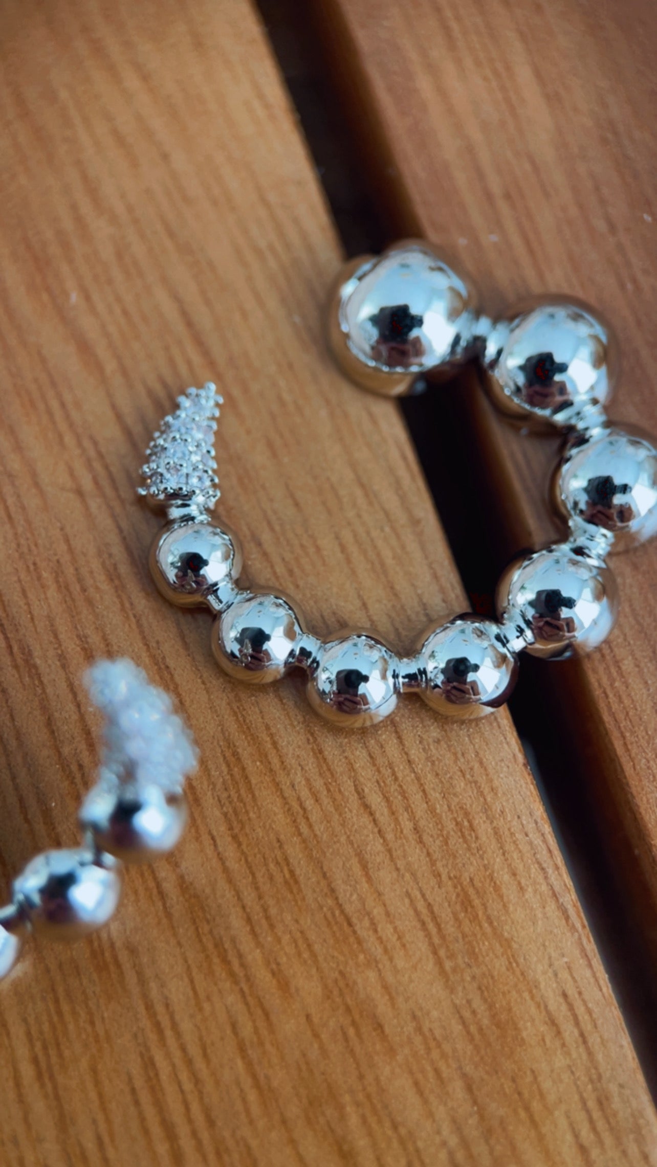 Brinco círcula cravejado níquel